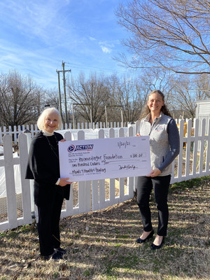 Action 247 CEO, Tina Hodges, presents first Action 100 check to Kathie Heimerdinger of the The Heimerdinger Foundation.