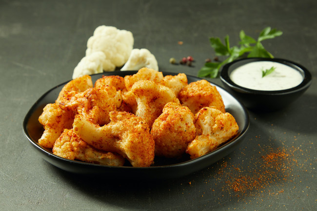 Donatos adds oven-baked cauliflower wings to its menu - first national pizza brand to do so.