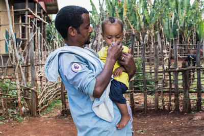 A man and his daughter were among the more than 7.5 million recipients of trachoma-fighting antibiotics distributed by Orbis in Ethiopia in December 2020. Photo: Genaye Eshetu