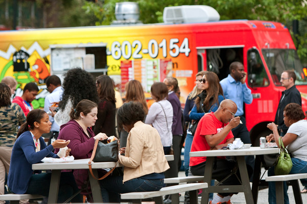 Image: Customers at food trucks in Atlanta, Georgia. Representatives from Georgia, including InvestAtlanta and the Georgia Housing Finance Authority, and 13 other states are participating in the Lincoln Institute's new Accelerating Community Investment Initiative. Credit: BluIz60/iStock Editorial via Getty Images Plus.