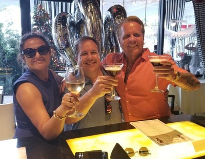 From left: Nina Das, Don Schwall, and David C. Branch toast to the New Year and to four successful New Year's Eve's closings.