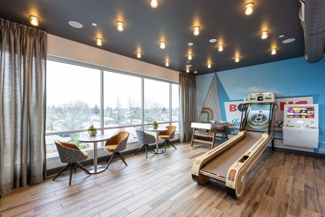 The ArLo Apartments property was built in 2019 and includes several desirable amenity spaces, such as this multi-purpose game room.