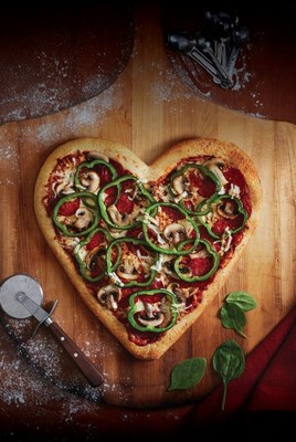 Boston Pizza franchisees from coast to coast are ‘raising dough’ for local charities as part of their annual Valentine’s Day fundraising drive centered around Heart-Shaped Pizzas. (CNW Group/Boston Pizza International Inc.)