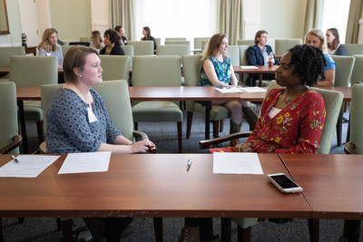 Students talking during North Carolina Humanities’ “Can We Talk” community program in Charlotte, N.C., in 2019. The forum led staff and board trustees to think about how NC Humanities could be more actively engaged in bringing empathy to the forefront of their work and spurred the nonprofit's rebranding effort.