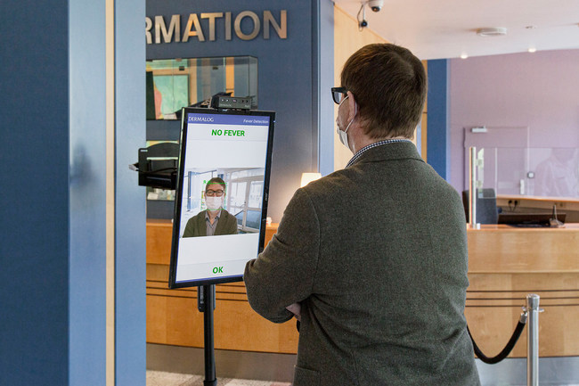Viral Defense Touchless Automated Fever Measurement equipment checks workers in the lobby before they enter their office.