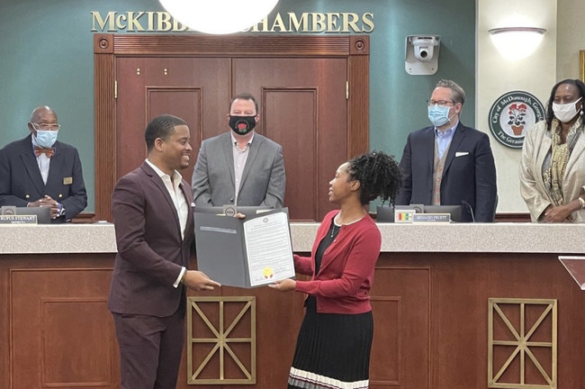 Reco receiving the proclamation declaring January 19th Mr. Reco McDaniel McCambry Day