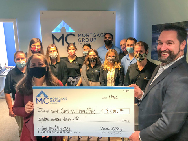 Patrick Stoy, Founder/President of MC Mortgage Group and the whole Wilmington office present a check for the 2020 People, Pets and Vets Program to Kendria Sweet of NCHF.