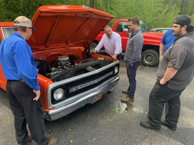 Title: Classic Car Restoration Competition | Caption: Hiester Automotive Group technicians, pictured from left Jimmy Dorman, dealer John Hiester, Brandon Pettigrew and Brendan Davis,  worked on restoring classic cars for an online auction to raise money for charity during the Covid-19 pandemic.