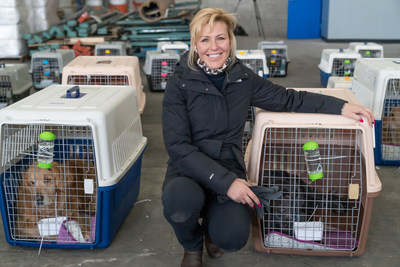Jill Stewart, President & Founder of China Rescue Dogs, welcomes a flight of dogs into JFK airport in January.