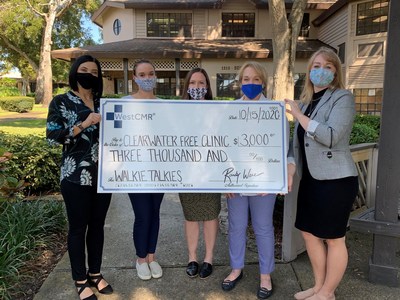 WestCMR team members present the Clearwater Free Clinic with a check for funds to purchase a new communications system.