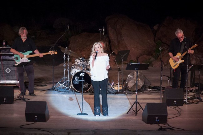 Laura Tate sings at a canyon amphitheater for her Roots Music Report number-one Jazzy Blues album, Laura Tate: Live from El Paso. Working with eight well-known L.A.-based musicians borrowed from top-ranked bands, Tate mesmerizes audiences with her smoky, sultry voice.