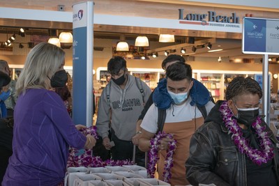 Hawaiian Airlines' guests received fresh lei and gifts while boarding the inaugural LGB-OGG flight Wednesday morning.  Photo credit: Long Beach Airport