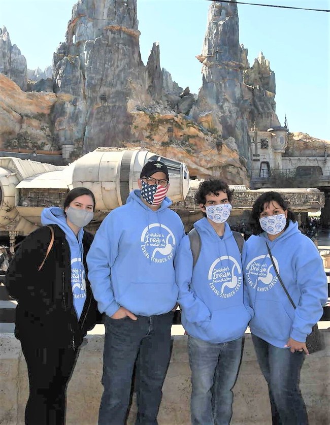 Family members Amber (Joey's sister), Dean (Joey's stepdad), 18-year-old stomach cancer survivor Joey Siwe, and Julie Feece (Joey's mother) enjoying the Star Wars: Galaxy's Edge experience at Disney World in Orlando, Florida, courtesy of DDF's Dream Makers Miracle Fund.