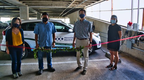 Members of the Hawaiian Electric Electrification of Transportation department, Hawaiian Electric Fleet, and Elemental Excelerator at the ribbon-cutting for for the pilot’s four charging stations managed by AMPLY Power