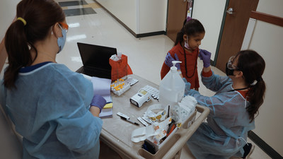 An elementary school student is receives a rapid antigen test using the BD Veritor™ Plus System for Rapid Detection of SARS-CoV-2.