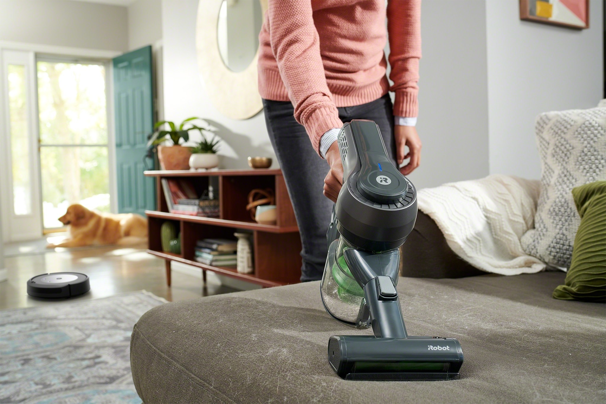 The iRobot H1 handheld vacuum rounds out a Roomba® or Braava® robot user’s cleaning routine by tackling spaces like couches and stairs. (PRNewsfoto/iRobot Corporation)