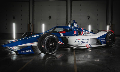 Indy Car Drivers Jimmie Johnson and Tony Kanaan pose with The American Legion 48 Car at the Team Ganassi Garage in Indianapolis, Ind., on Tuesday, April 6. Photo by Adam Pintar/The American Legion