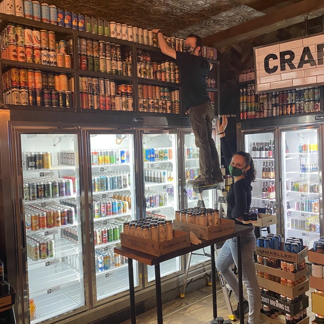 Stocking up the over 300 beers, ciders, hard seltzers, and other craft beverages.