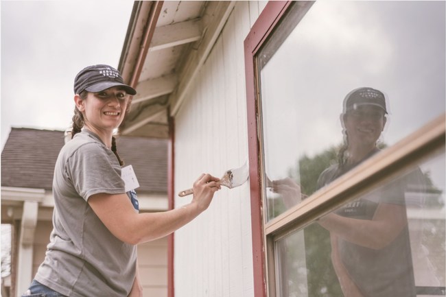 Caitlin Esping of OneStar volunteers painting a house damaged during Hurricane Harvey in Dickinson. National Volunteer Week recognizes the impact volunteer service has on communities, as well as the power of volunteers to tackle society's greatest challenges and provides the perfect opportunity for OneStar to launch VolunteerTX. Photo Credit: Joshua Winata/OneStar