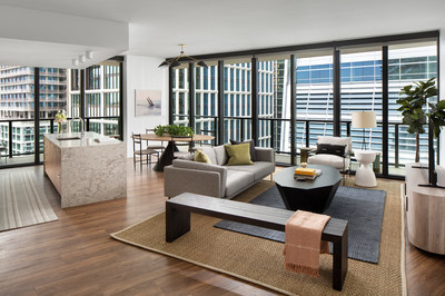 This photo shows the living room in a two-bedroom model unit in Heron, a new residential rental building that welcomed the first residents to the highly anticipated Water Street Tampa neighborhood.