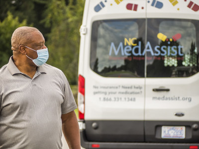 A local volunteer helps distribute medicine items at one of NC MedAssist's weekly Mobile Pharmacy Events.