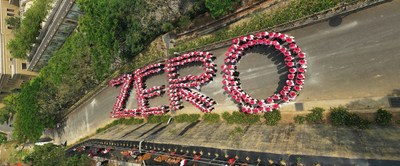 Hundreds of people assembled together to form the letters "Z," "E," "R," and "O" at the entrance to one of T-Earth's forests at Fo Guang Shan, Taiwan.