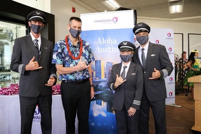Hawaiian Airlines President and CEO Peter Ingram (second from left) pictured with HA82's pilot crew at Honolulu's Daniel K. Inouye International Airport prior to the inaugural flight