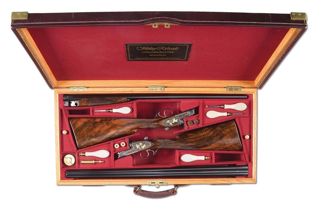 Cased pair of circa-1993 bespoke Westley Richards & Co. (England) deluxe-grade sidelock side-by-side game shotguns. Gold-inlaid and engraved by master engraver Allan Brown. One of 11 Westley Richards shotguns generously consigned by the Larry and Brenda Potterfield family with 100% of hammer proceeds directly benefiting the NRA Whittington Center. Estimate $80,000-$100,000