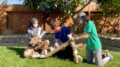 A team of middle school students created a cardboard strider that turns into a bike for The Tech Challenge: Ultimate Upcycle, presented by Zoom Video Communications. Students learn teamwork, creativity and perseverance in the youth engineering program by The Tech Interactive, a science center in San Jose.
