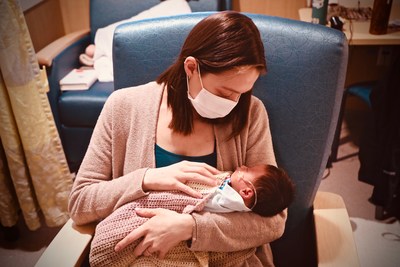 Kelsey Song holds her baby daughter, Flora, while she recovers in the NICU at Cincinnati Children's. Kelsey was the 100th patient to undergo a prenatal surgical repair after her daughter was diagnosed with spina bifida while 20 weeks pregnant.