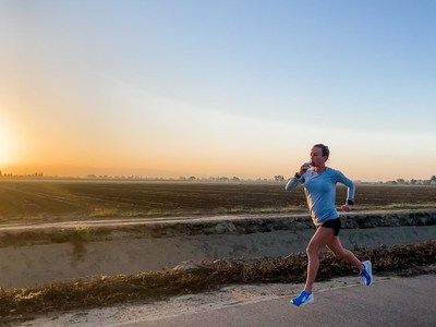A runner takes in fuel during a training run. The next generation of wearable technology will change how athletes fuel for sport.