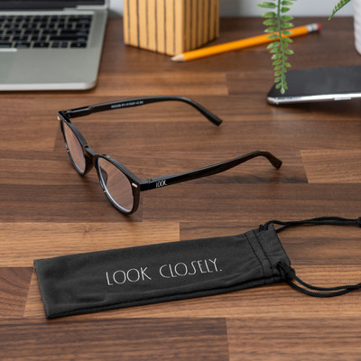 Rae Dunn Eyewear launches readers and blue light-blocking glasses. Included hard cases and microfiber pouches showcase the artist's signature wordmarks.