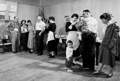 Two Public Health Nurses are vaccinating adults at a polio clinic in Southey, SK, courtesy of Library and Archives Canada (CNW Group/Public Health Agency of Canada)