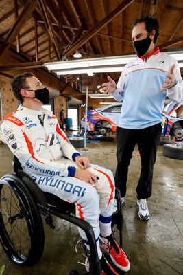 Robert Wickens (left) and Bryan Herta talk about the track session.