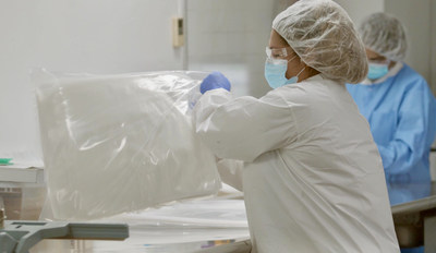 Technicians inspect bags in Fruth's cleanroom facility.