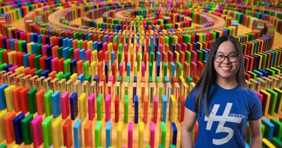 Domino artist and YouTube influencer Lily Hevesh (@Hevesh5) with her latest creation. Launched to support the call for fairer vaccine distribution worldwide, in collaboration with global charitable foundation Wellcome and partners UNICEF and GAVI. Watch the dominoes topple at https://www.youtube.com/watch?v=ugbX9uF6-x0 (PRNewsFoto/Wellcome)