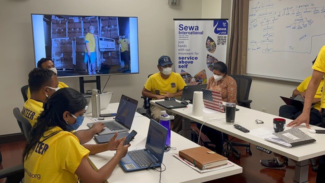 Sewa International Volunteers Busy at Work in the Sewa Procurement Control Room in Atlanta, GA.
