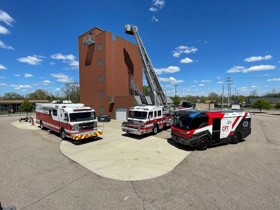 America's first electric fire truck on display (far right), alongside existing fire trucks, for firefighters across the midwest.