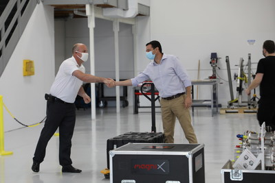 Ganzarski (left) and Bar-Yohay (right) shake hands as the electric propulsion units are delivered to Eviation's facility in Arlington, Wash.