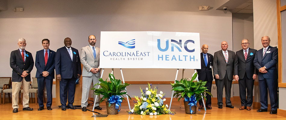 Members of CarolinaEast Board of Directors, CarolinaEast Health System CEO/President Ray Leggett and UNC Health Chief Operating Officer Steve Burriss celebrate the announcement of a comprehensive affiliation between the two award-winning organizations. This collaboration will help strengthen rural healthcare throughout the Eastern Region.