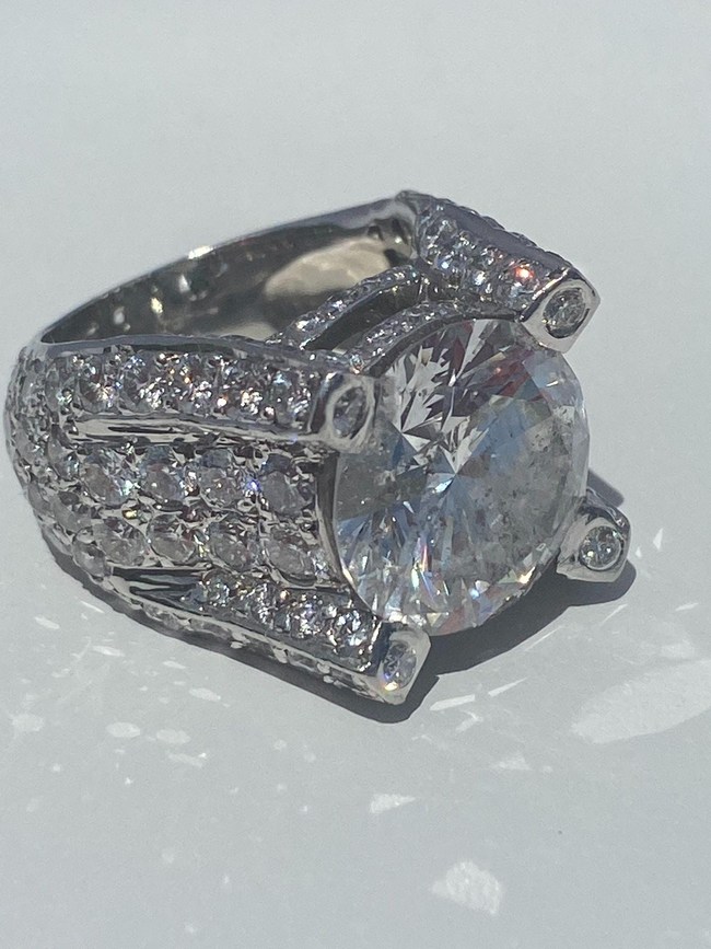 Spectacular custom-designed platinum ring with certified 10.22-carat center diamond, F color, surrounded by another 8.5 carats of diamonds. EGL certificate. Provenance: Estate of Kelly I. Martin. Estimate $100,000-$200,000