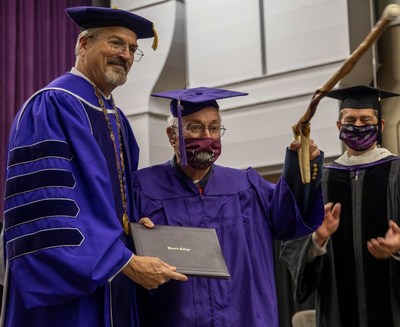 Lincoln College President David Gerlach pictured with William "Bill" Gossett at Commencement.