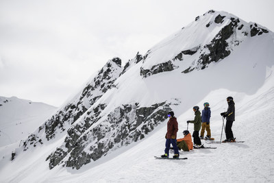 Friends skiing and snowboarding with a Mountain Host in Whistler Blackcomb. Source: Strain