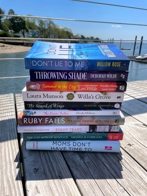Memorial Day Weekend Books: The Sound Of Wings by Suzanne Simonetti; Don’t Lie To Me by Willow Rose; Willa’s Grove by Laura Munson; Eight Years by Donna Schwartze; Throwing Shade by Deborah Wilde; Moms Don’t Have Time To: A Quarantine Anthology by Zibby Owens; Ruby Falls by Deborah Goodrich Royce; The Lost Boys Of Montauk by Amanda M. Fairbanks; The Desire Factor by Christy Whitman; and Summer In The City by Lori Wilde, Priscilla Oliveras, Sarah Skilton.