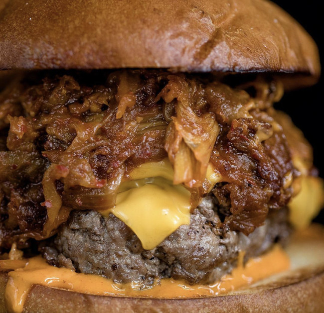 Chef Esther Choi of NYC's Mokbar and Ms. Yoo created the winning burger with a custom burger blend, topped with kimchi bacon onion jam, American cheese, and gochujang aioli on a brioche bun.