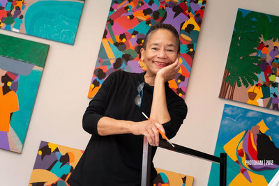 Synthia SAINT JAMES among some original paintings in her Los Angeles studio.