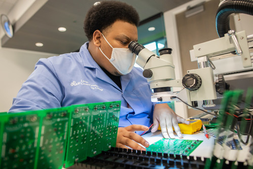 DeAndre Lurry, member of the inaugural graduating class of the Bachelor of Applied Science degree in microelectronic manufacturing, gaining hands-on training.