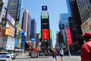 "Pineapples from Guangdong, China, a burst of flavor in every bite" appears on the China Screen of Times Square, New York