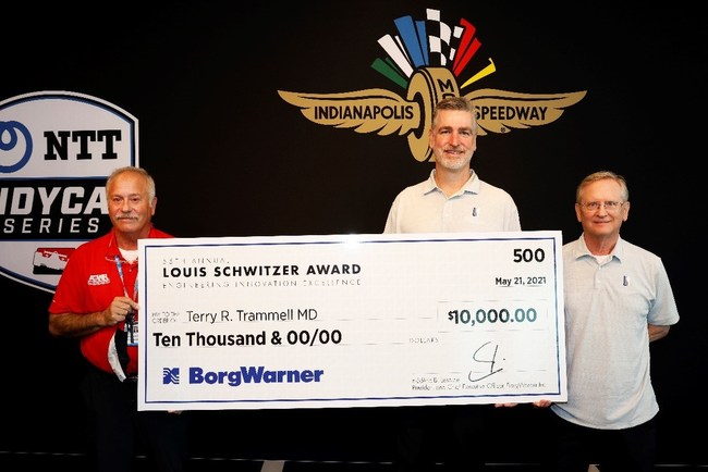 John Norton and Steve Sholman award $10,000 check to Dr. Terry R. Trammell for 2021 Louis Schwitzer Award