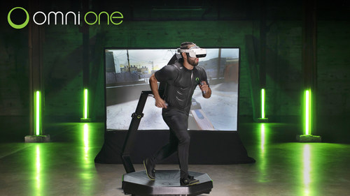 A players walking on the Omni One virtual reality treadmill.